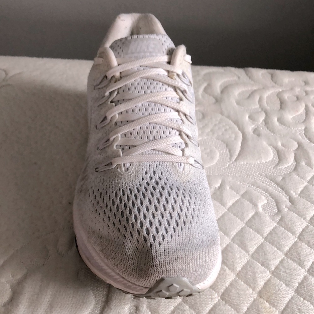 White Nike running shoes, size 8 women’s shoes.